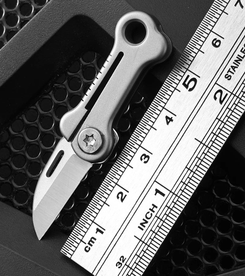 Mini EDC folding knife in bone shape with titanium alloy handle
