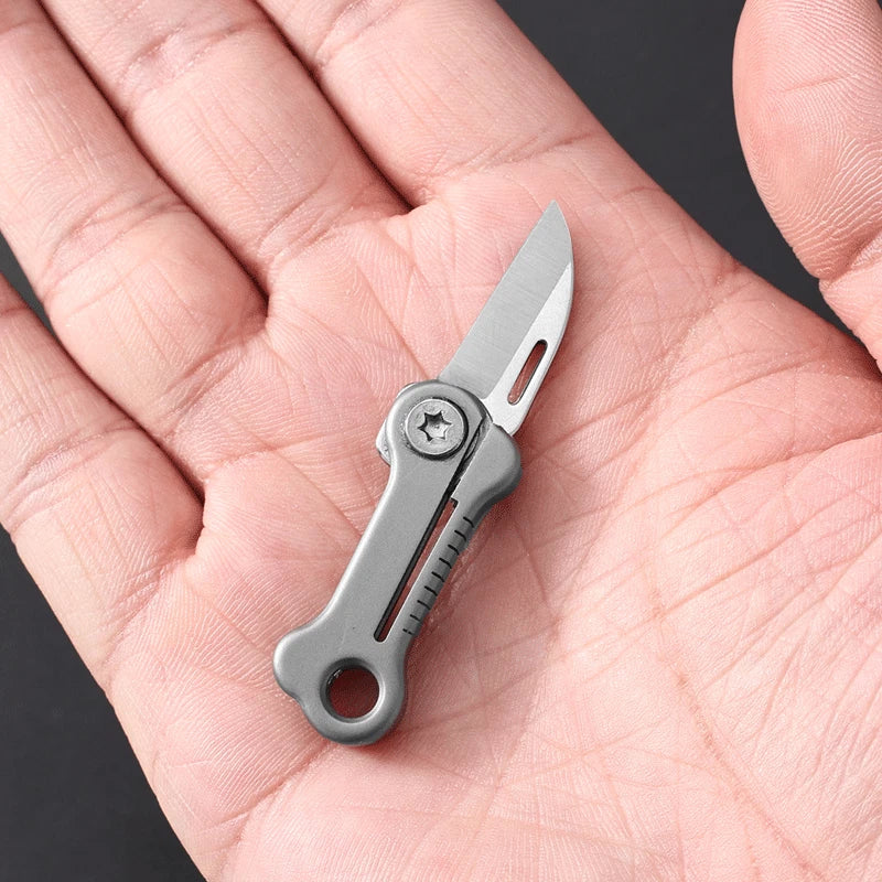 Mini EDC folding knife in bone shape with titanium alloy handle