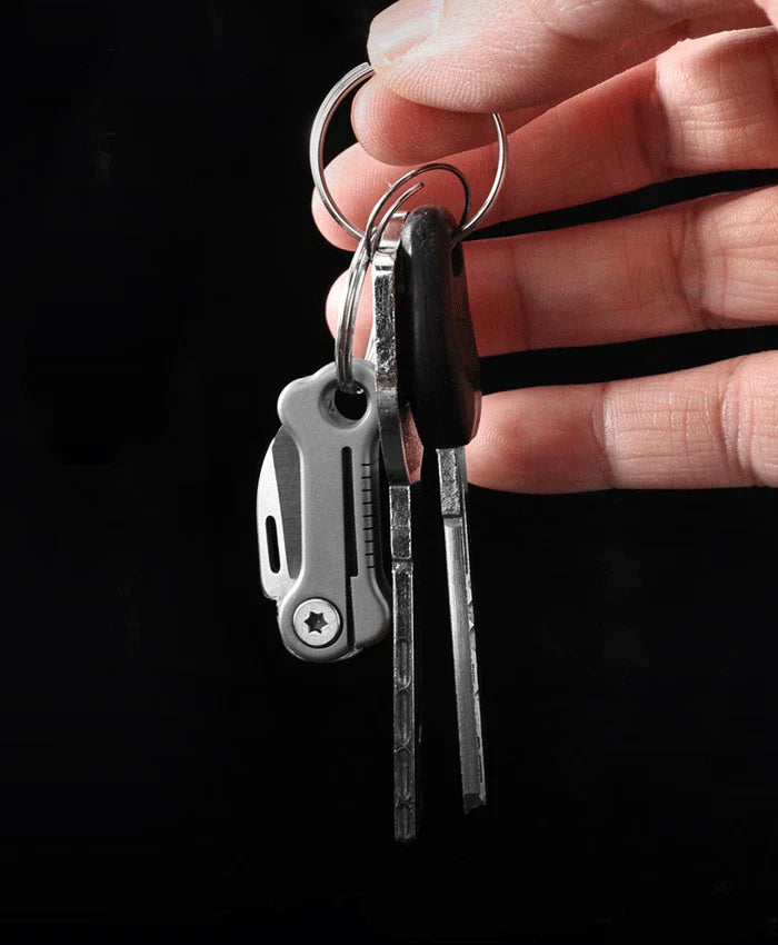 Mini EDC folding knife in bone shape with titanium alloy handle
